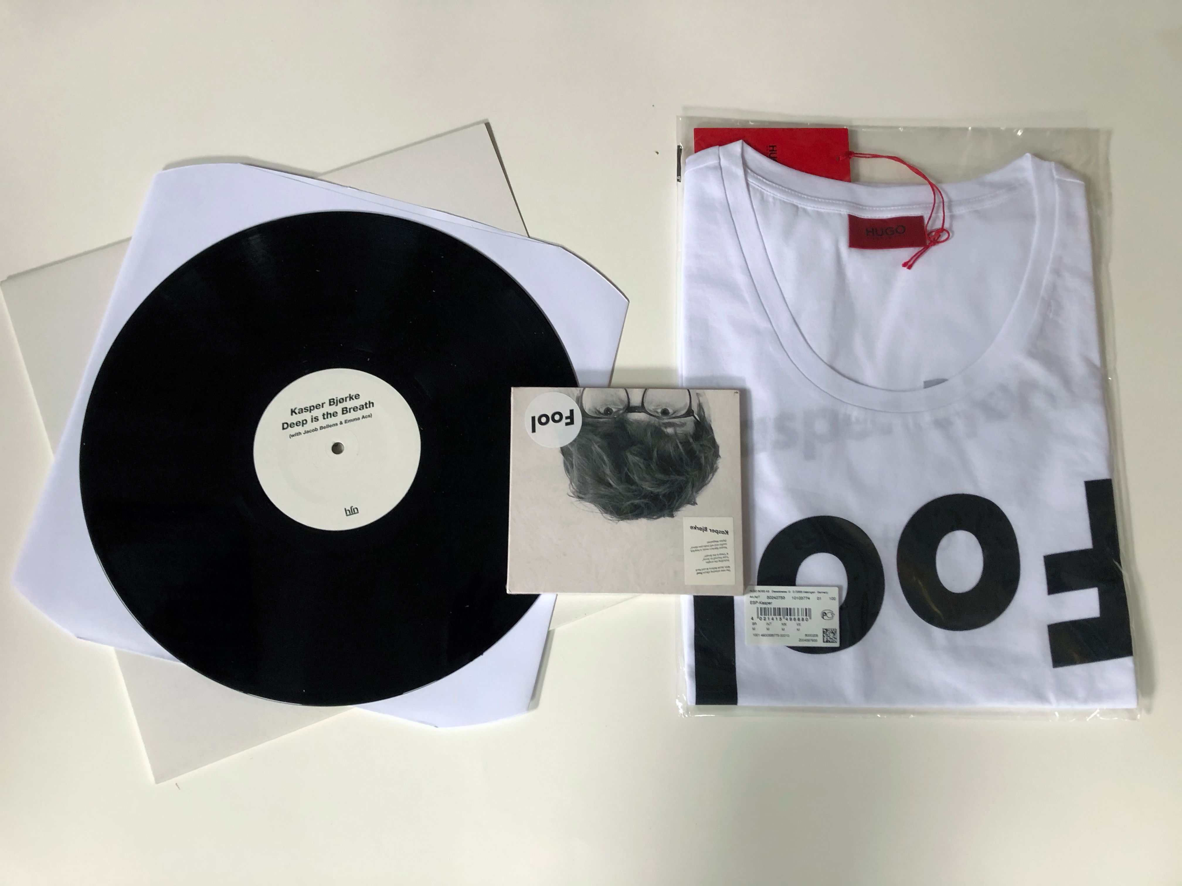 A Bandcamp exclusive bundle including the Hugo Boss "Fool" T-shirt, the CD album "Fool" the 12" vinyl EP "Deep Is The Breath" and the digital album "Nothing Gold Can Stay Remixes Part A".
